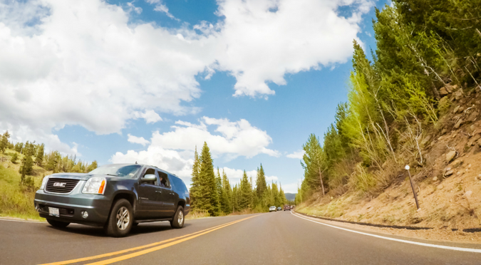 Car driving on a mountain road.