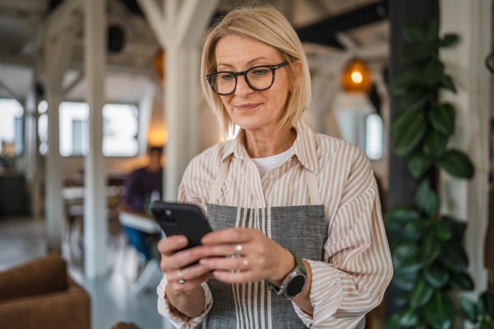 female business professional looking at phone