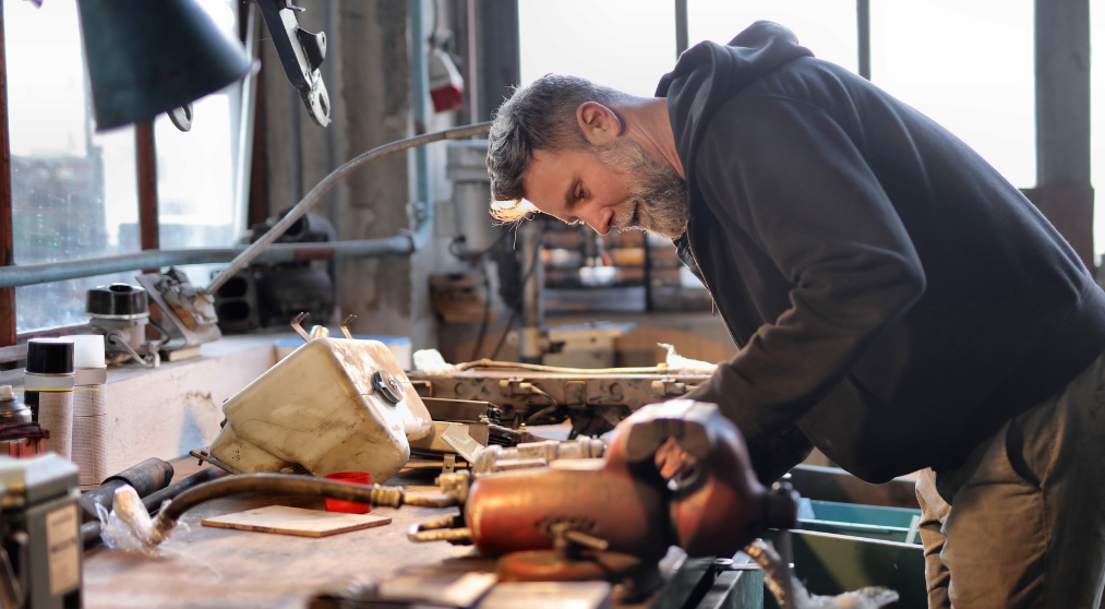 Man working on hardware equipment.