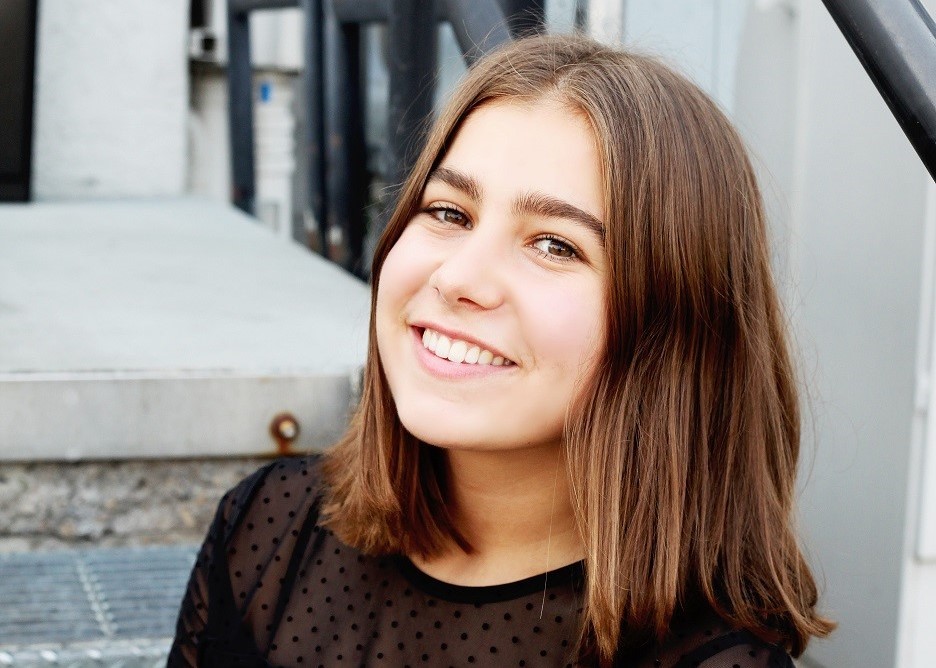 Smiling girl scholarship recipient. 