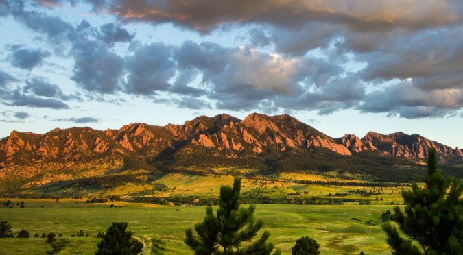Green pasture and mountains.